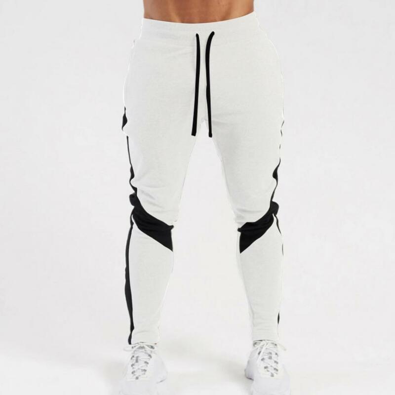 Spodnie na codzień męskie modne sportowe spodnie ściągane sznurkiem z kieszeniami szybkoschnące spodnie pełnej długości na wiosenną jesień gumką