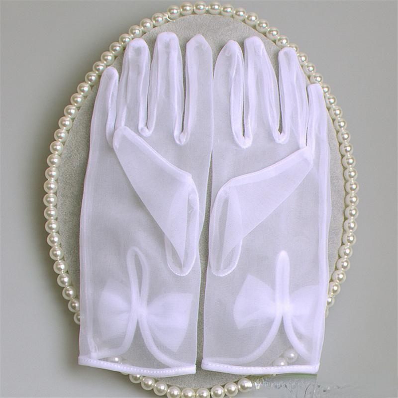 Krótkie proste ślubne rękawiczki ślubne z kokardką białe/kość słoniowa wysokiej jakości tiul Sheer długość nadgarstka pełne rękawiczki weselne