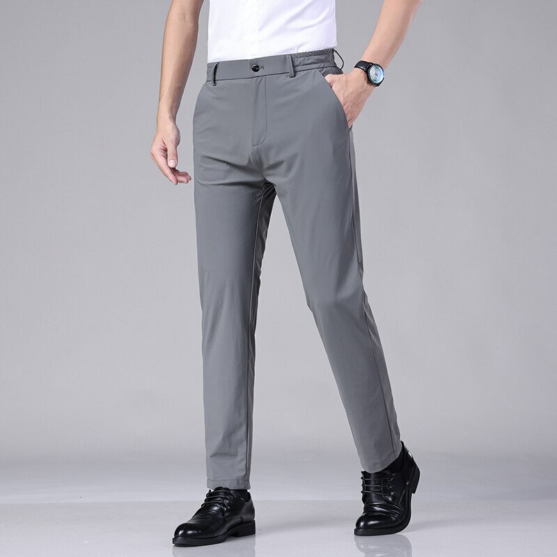 2023 estate pantaloni Casual uomo sottile Business Stretch Slim elastico in vita Jogger coreano classico sottile nero grigio blu pantaloni maschili