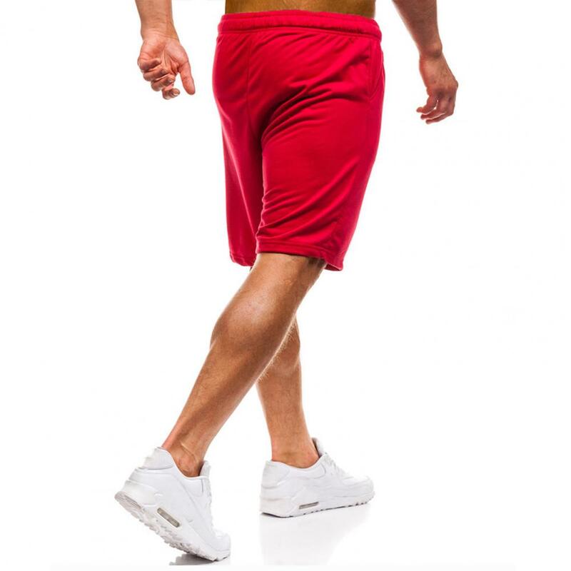 Celana pendek atletik pria, celana pendek atletik musim panas dengan tali serut elastis kantong pinggang warna Solid untuk Streetwear