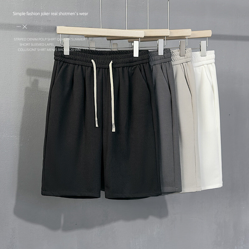 Pantalones cortos informales para hombre, ropa deportiva holgada, elástica, con cordón, hasta la rodilla, color blanco y negro, novedad de verano