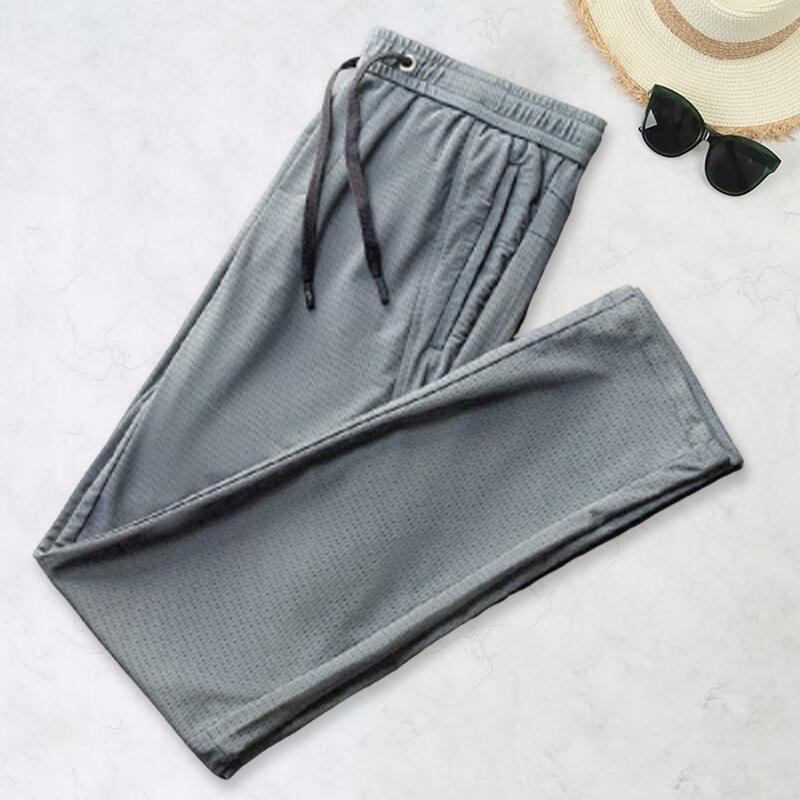 Men Sport Pants Solid Color Breathable Deep Crotch Loose Drawstring Ankle-banded Zipper Pockets Mesh Men Sweatpants Male Clothes