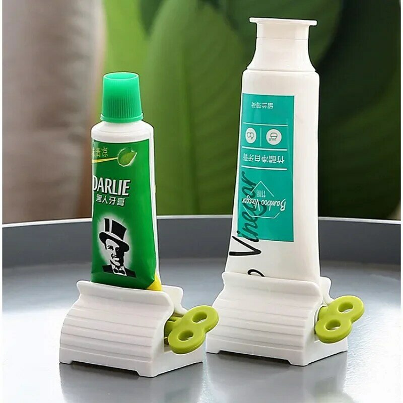 Mini exprimidor de pasta de dientes de tubo rodante, dispensador de soporte de asiento, productos de baño de fácil limpieza, exprimidor de cosméticos para el hogar