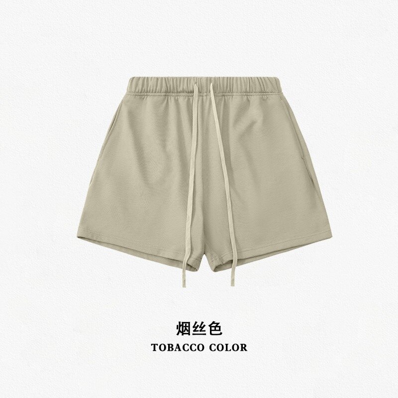 Pantalones de cinco cuartos sueltos de marca de moda de calle de Color niebla de primavera y verano