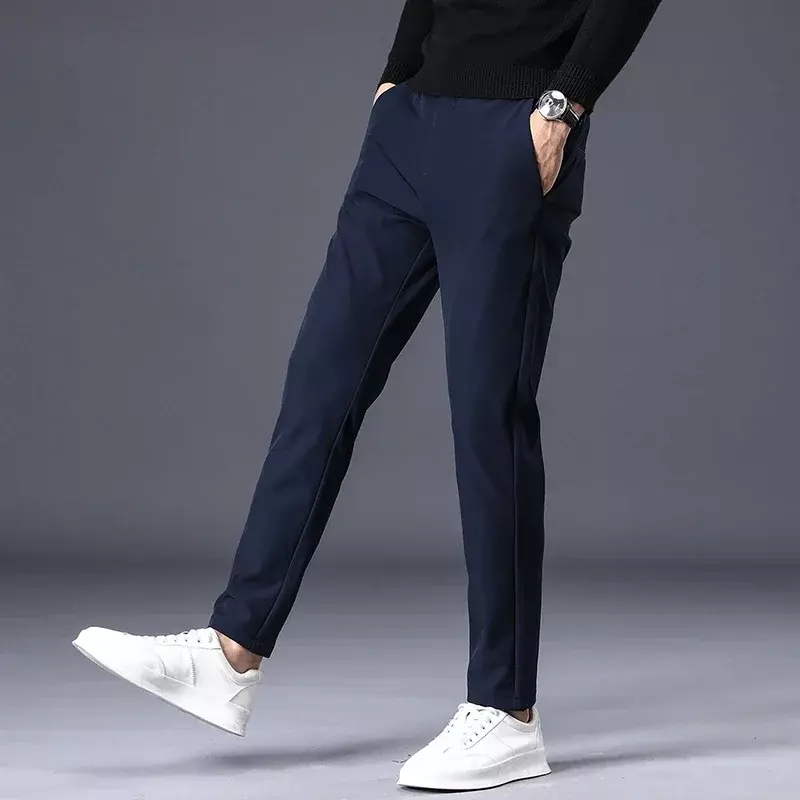 Jesienne spodnie zimowe męskie zagęścić podszyty polarem ciepłe w pasie spodnie dresowe na zewnątrz moda Slim szary garnitur spodnie męskie