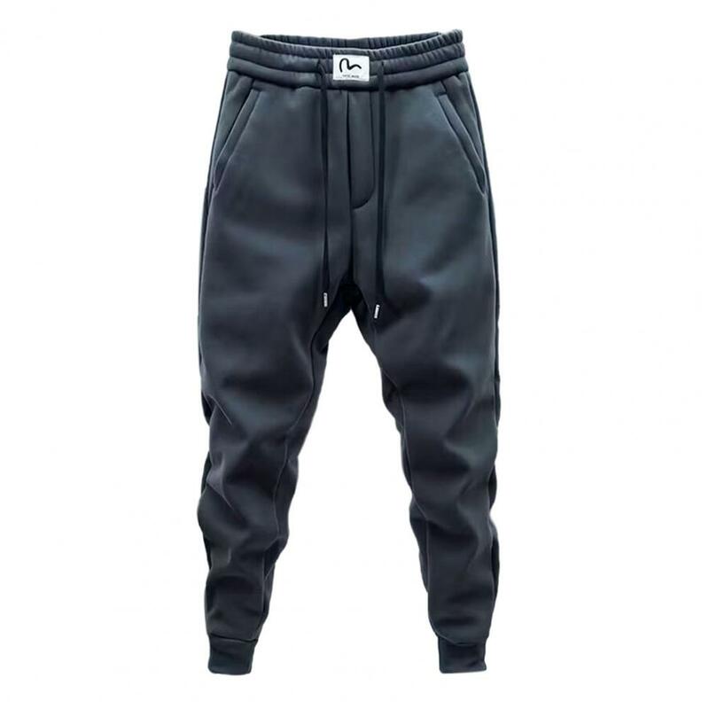 Męskie spodnie typu Casual ciepło, przytulnie męskie spodnie dresowe z ściągany sznurkiem w pasie kieszeniami na jesienną zimę miękkie grube Fitness