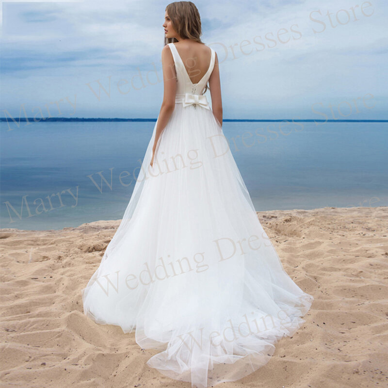 Simple Generous A Line Women's Wedding Dresses Charming Sleeveless Backless Bride Gowns Sashes Tulle Beach فساتين حفلات الزفاف