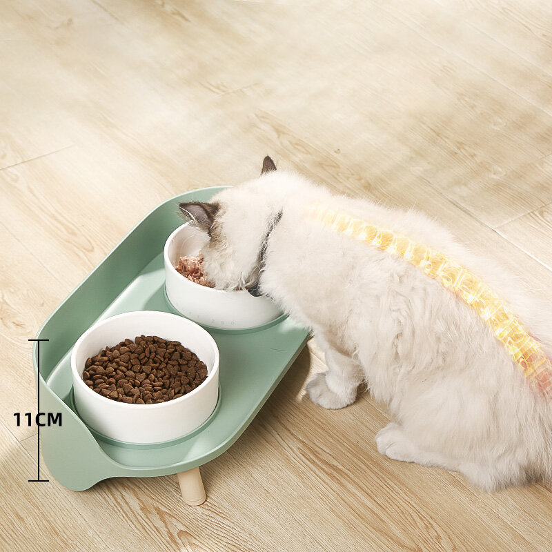 La ciotola per gatti per cani rialzata antigoccia Semi chiusa protegge la ciotola per gatti Vertebra del gatto alimenta cibo e acqua in accessori per animali domestici con un solo design