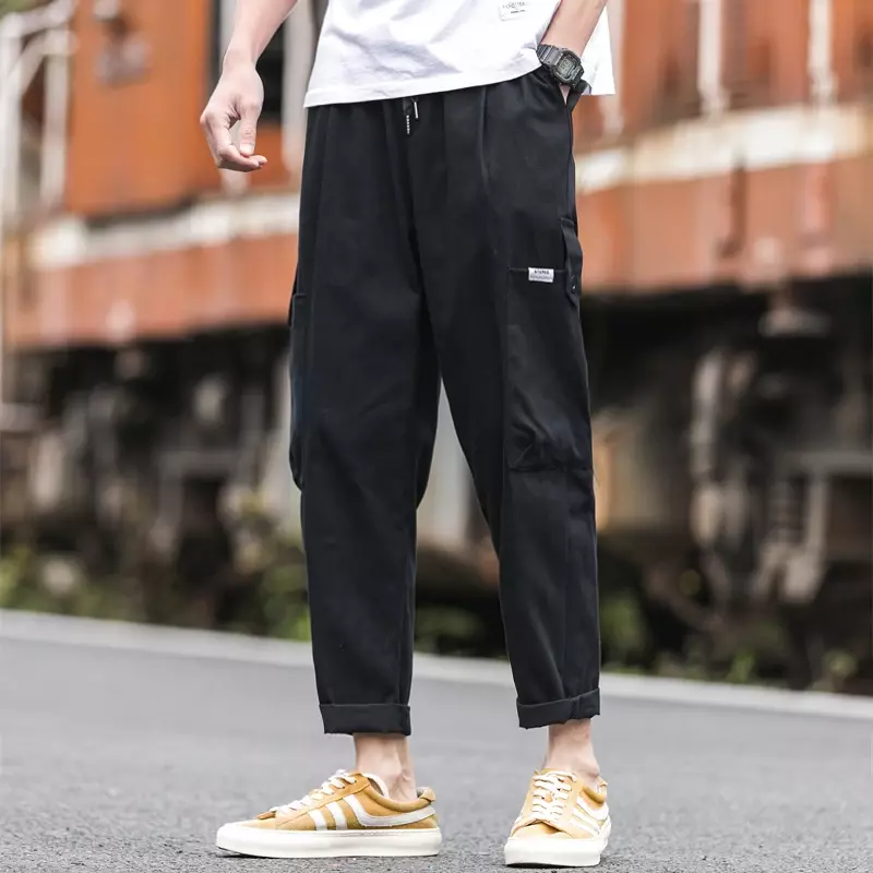 Hip-hopowe kombinezony męskie Harajuku haremowe spodnie Street Casual spodnie do joggingu kieszonkowe sznurowane nogawki męskie spodnie M-5XL