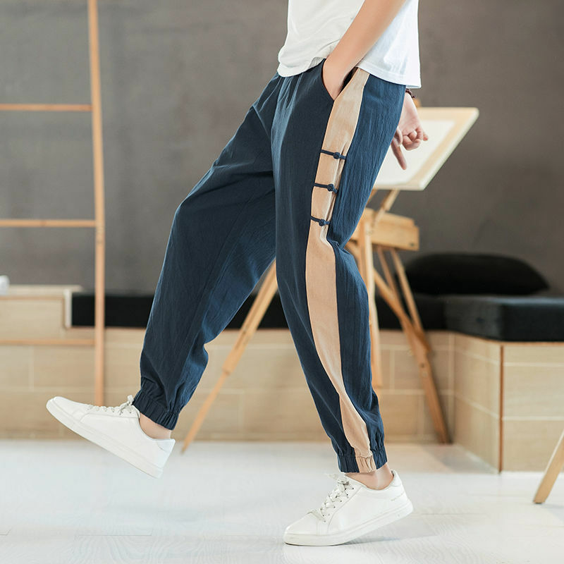 Chiński styl męski 2024 lato nowy patchwork wysokiej talii elastyczne kieszenie w jednolitym kolorze na wygodne luźne spodnie na co dzień