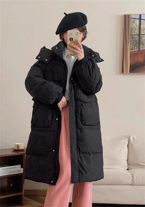 Piumino con fibbia in vacchetta con nappe per l'inverno da donna nuova giacca di Design ampia con cappuccio e addensato di media lunghezza