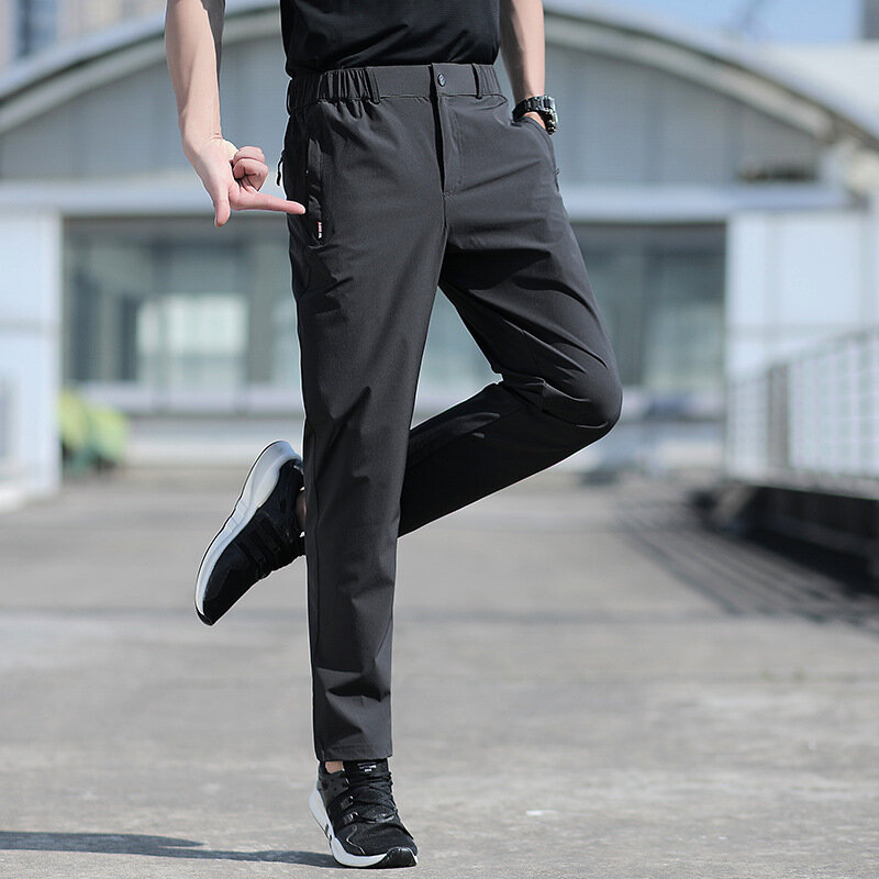 Duży rozmiar męski spodnie na lato duży rozmiar lodowy jedwab rozciągliwy oddychający proste nogawki 6XL szybkoschnący elastyczny pasek czarne spodnie