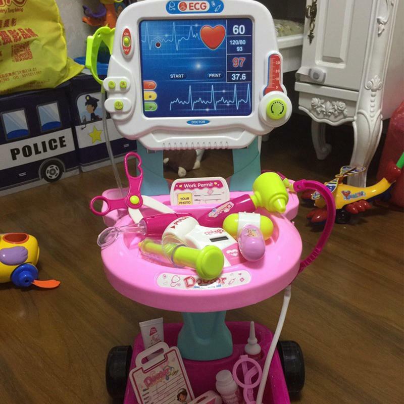 Dzieci zabawki do zabawy w lekarza chłopców dziewczyny udają symulację stetoskopu elektrokardiogramu wózek medyczny zestaw lekarza dzieci bawią się zabawki domowe