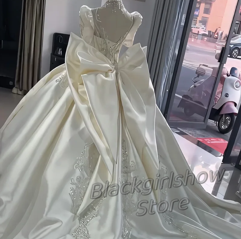 Abito da sposa bianco Vestidos De 15 asenos cappella treno lusso cristallo Applique raso grande fiocco spalline abiti da sposa