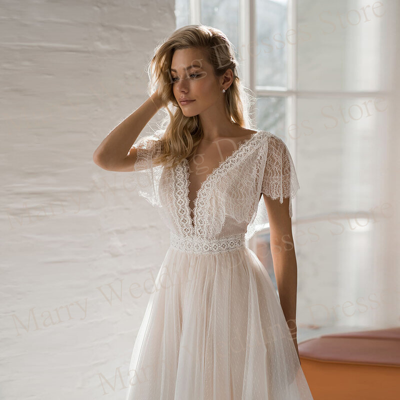 Fascynujące nowoczesne damskie suknie ślubne z linii klasyczne koronki aplikacje suknie panny młodej Sexy V dekolt bez pleców tiulowa szata De Mariée