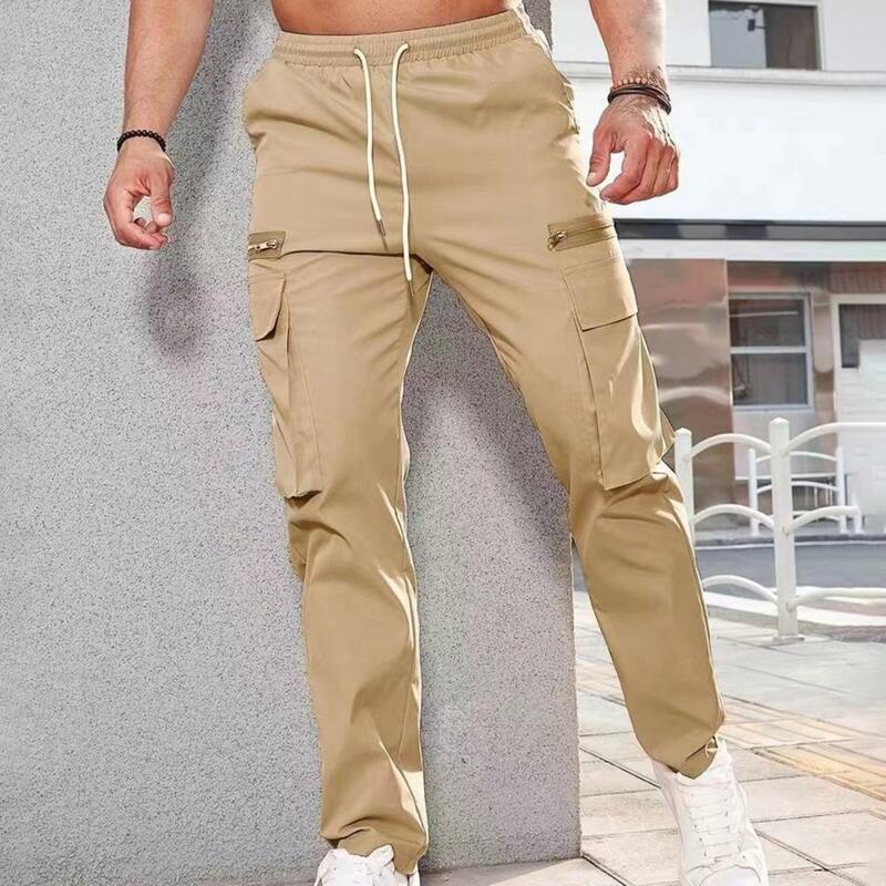 กางเกงคาร์โก้ผู้ชายมีเชือกผูกเอวยางยืดกางเกงเอวหลวมมีซิปตกแต่งกระเป๋าหลากหลายสีทึบระบายอากาศได้