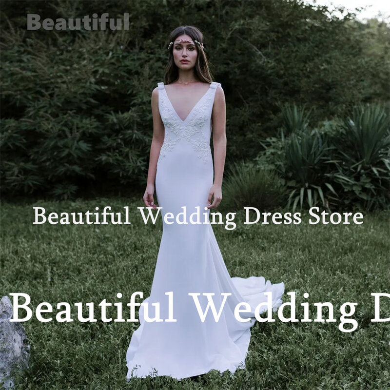 Neue Vestidos Hochzeits kleid tiefen V-Ausschnitt ärmellose Spitzen applikationen bodenlangen Satin Meerjungfrau Hochzeits feier Kleid Roben de Mariée