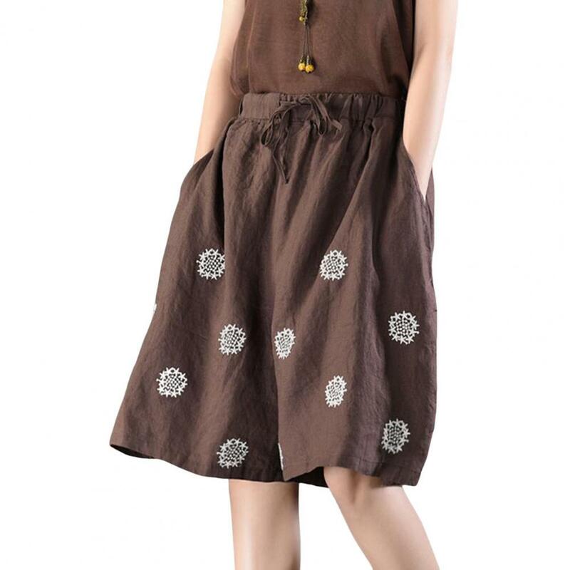 Celana pendek pantai pinggang tinggi wanita, celana pendek motif bunga kaki lebar dengan kantong tali serut yang bisa disesuaikan untuk wanita