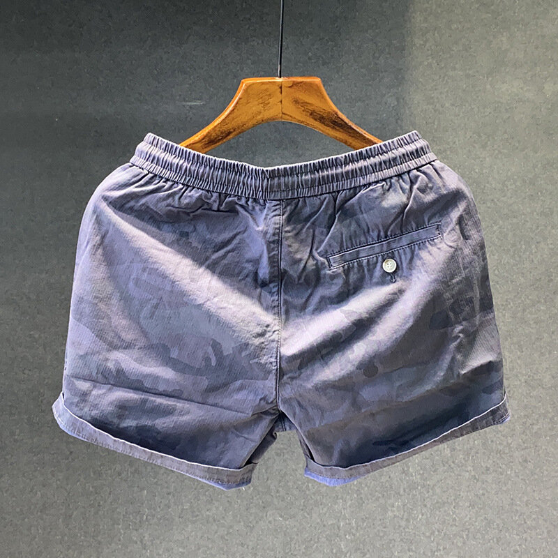 Letnie szorty kamuflażowe męskie spodnie o średniej długości z elastyczną talią luźne trzy czwarte modne sportowe spodnie plażowe