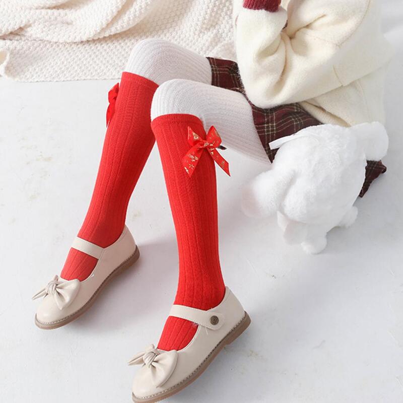 ถุงเท้ายาวสำหรับเด็กผู้หญิงถุงเท้าเด้งขึ้นรูปโบว์สีบรอนซ์สำหรับเทศกาลปีใหม่