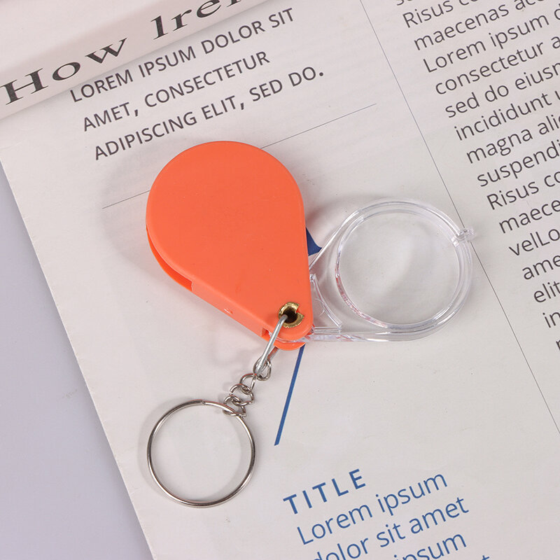 Lensa pembesar definisi tinggi oranye portabel, kaca pembesar saku orang tua, kaca pembesar gantungan kunci lipat genggam kecil