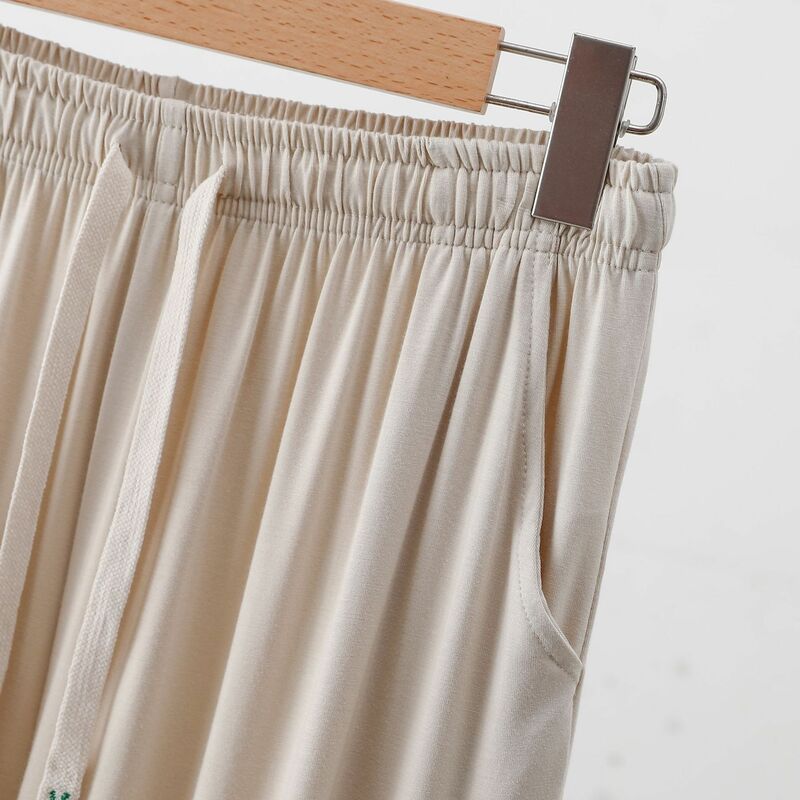 Gorąca sprzedaż modalne spodnie męskie spodnie od piżamy wiosna jesień luźna odzież do spania sznurkiem spodnie domowe 2024 nowa codzienna odzież codzienna męska