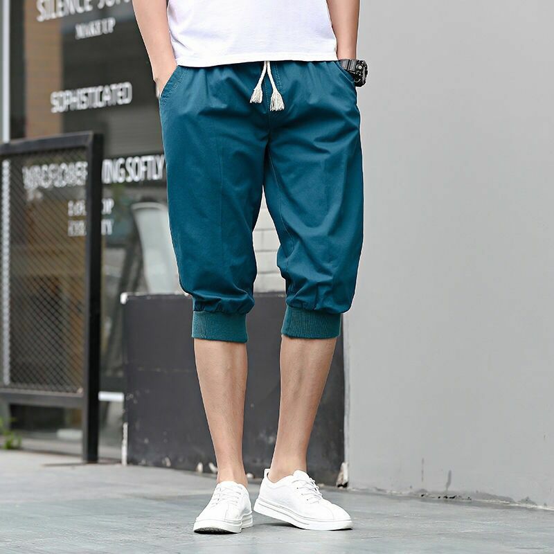 Estate nuova tendenza sportiva Versatile pantaloncini Casual da uomo solido elastico in vita tasche con coulisse pantaloni corti in cotone lunghezza polpaccio