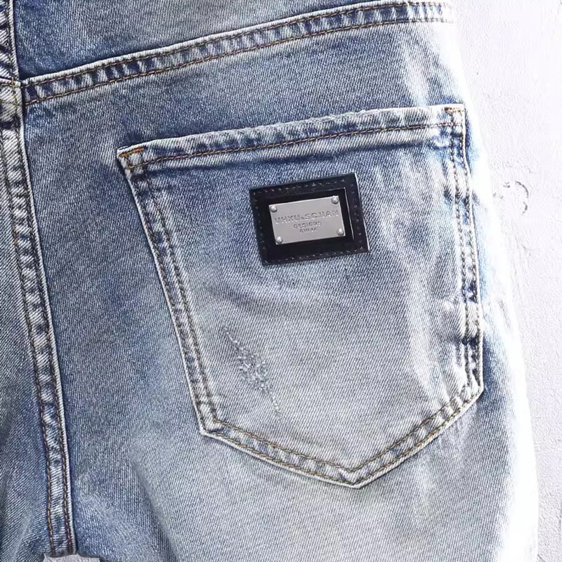 Modne dżinsy męskie uliczna wysokiej jakości niebieskie w stylu Retro rozciągliwe dopasowanie nadające się porwane jeansy mężczyzn łatane designerskie spodnie dżinsowe w stylu Vintage Hombre