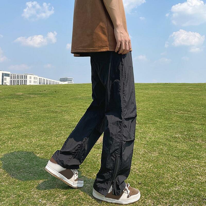 Spodnie o jednolitym kolorze męskie spodnie ze sznurkiem męskie spodnie dresowe z szerokimi nogawkami Plus Size z zapinanym na zamek rąbkiem boczne kieszenie dla trening gimnastyczny