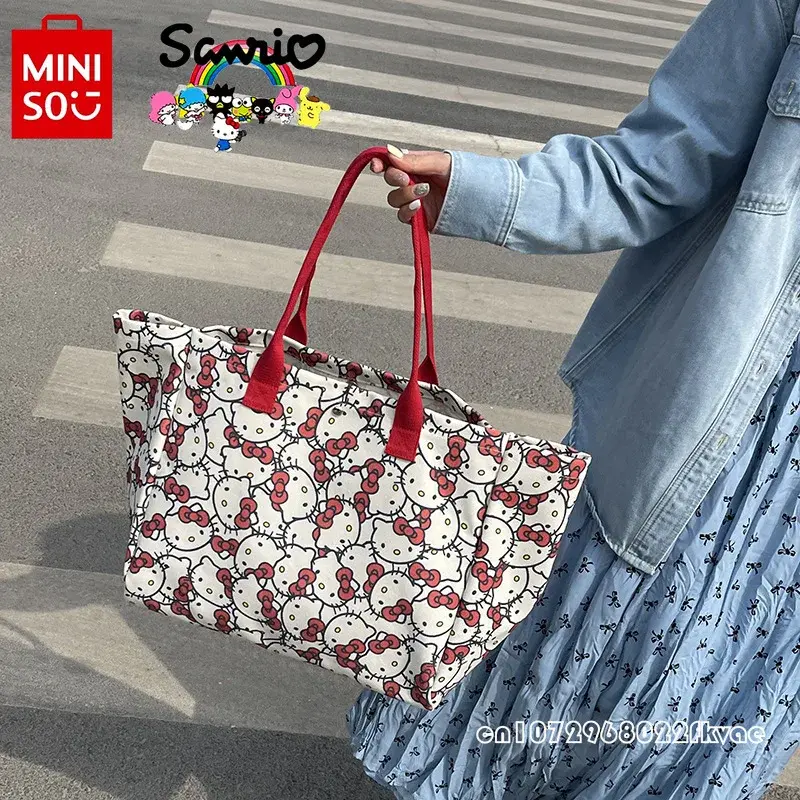 กระเป๋าถือผู้หญิง MiniSO HelloKitty ใหม่กระเป๋าช้อปปิ้งของของผู้หญิงความจุขนาดใหญ่การ์ตูนกระเป๋าสะพายไหล่ที่ทันสมัยของของผู้หญิงที่มีคุณภาพสูง