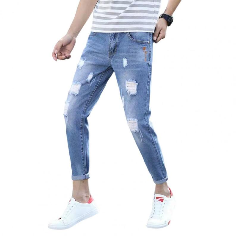Calças jeans de origem média estilo coreano para homens, botão, zíper, bolsos voadores, furos rasgados, streetwear slim fit
