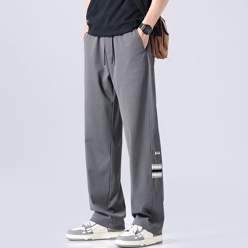 Wiosenne jesienne codzienne męskie spodnie proste nogawki luźne spodnie ze sznurkiem elastyczne w talii sportowe spodnie męskie Somfortable dresowe