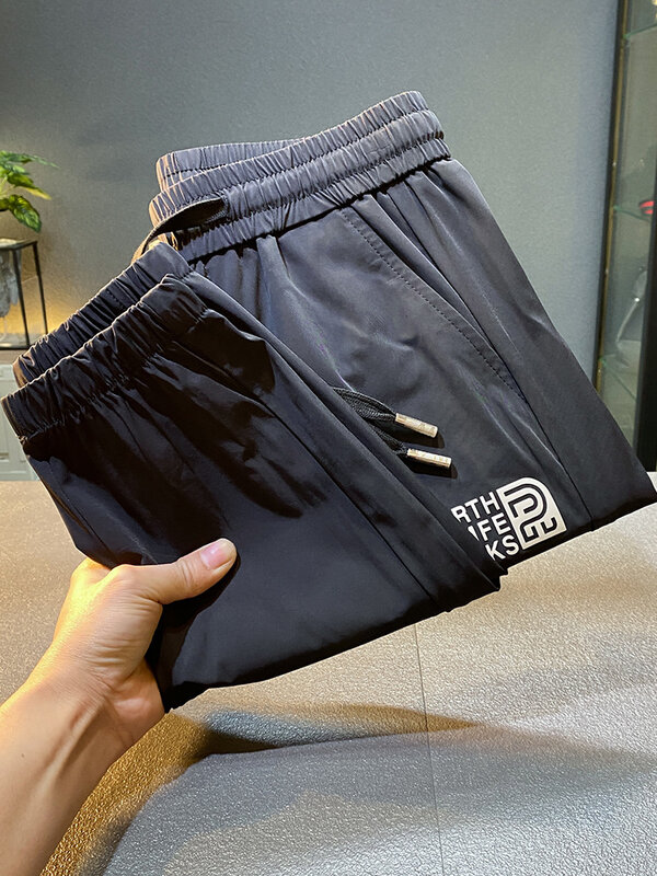 Light luxury draping silky casual pants men's summer Thin Ice Silk quick-drying cool cropped sports jogger pants