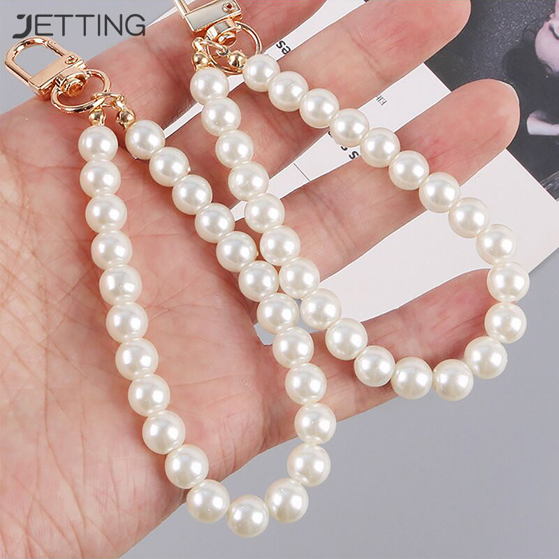Llaveros de aleación con cuentas de perlas para mujer, bolso de coche minimalista, Auriculares Bluetooth, llaveros colgantes, accesorios de joyería