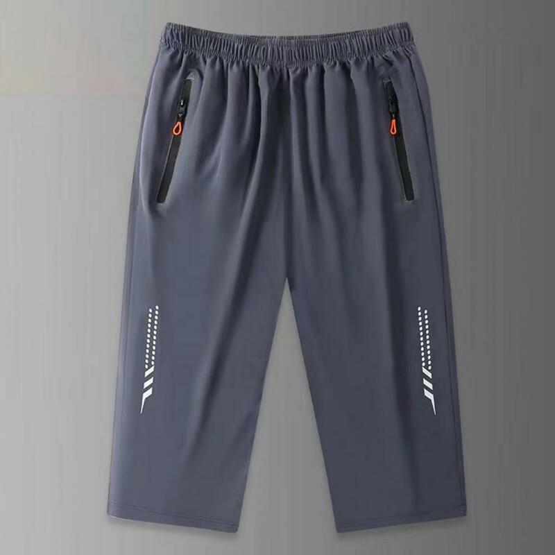 Celana pria crop Ice Silk lembut, celana ikat pinggang elastis dengan kantung ritsleting, teknologi cepat kering untuk atlet