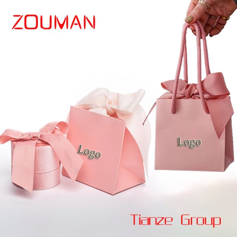 Bolsa de papel de compras con asas de cinta, papel personalizado impreso con su propio logotipo, regalo de joyería artesanal, color blanco y rosa