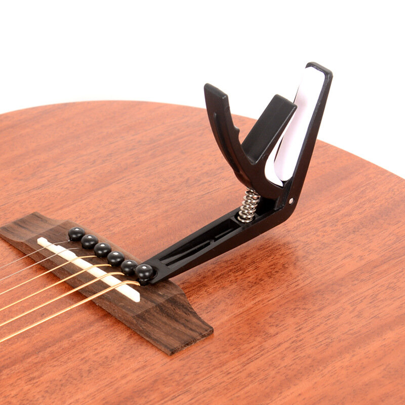 Clip de Capo para guitarra acústica Universal, abrazadera de Metal de plástico con herramientas de cambio de cuerdas para guitarra eléctrica clásica de madera y ukelele