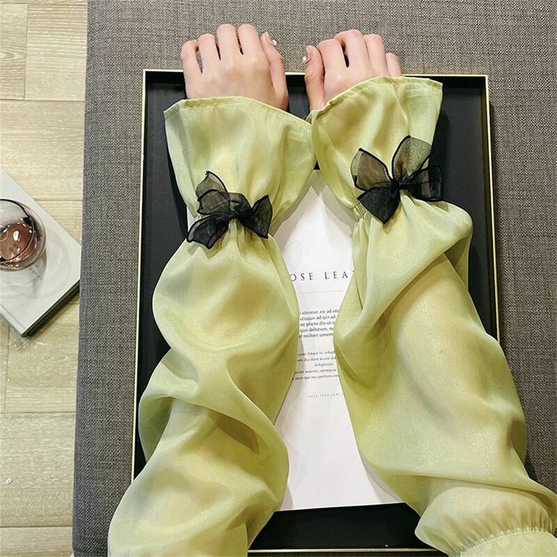 Manicotti lunghi senza dita protezione solare scaldamuscoli estivi traspiranti copri braccio in Nylon manica in seta di ghiaccio con fiocco per le donne