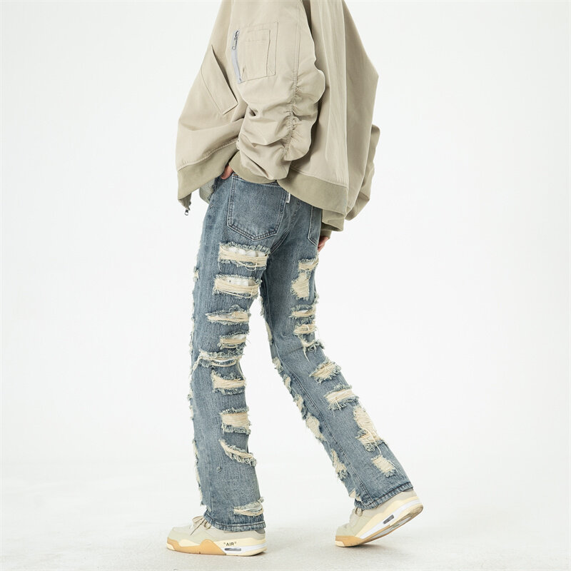 Uliczna męska Hip-hopowa porwane jeansy jesienna nowa w stylu Harajuku z kocimi wąsami wyciętymi prostymi nogawkami luźne jeansy ubrania Y2k
