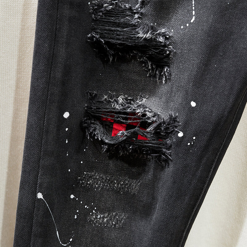 Spersonalizowane czarne dżinsy obcisłe malowane sprayem rozciągliwe bawełniane obcisłe spodnie koreańska moda zgrywanie młodzieżowe spodnie dżinsowe z małą stopą