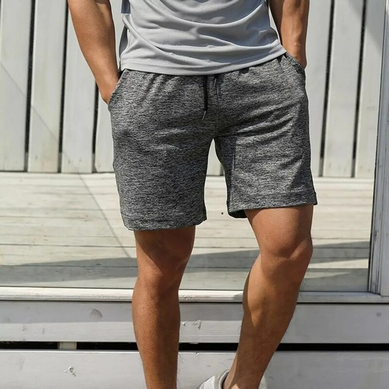 Pantalones cortos deportivos con bolsillos laterales para hombre, pantalón de chándal de entrenamiento, de cintura elástica ancha, con cordón, Color sólido