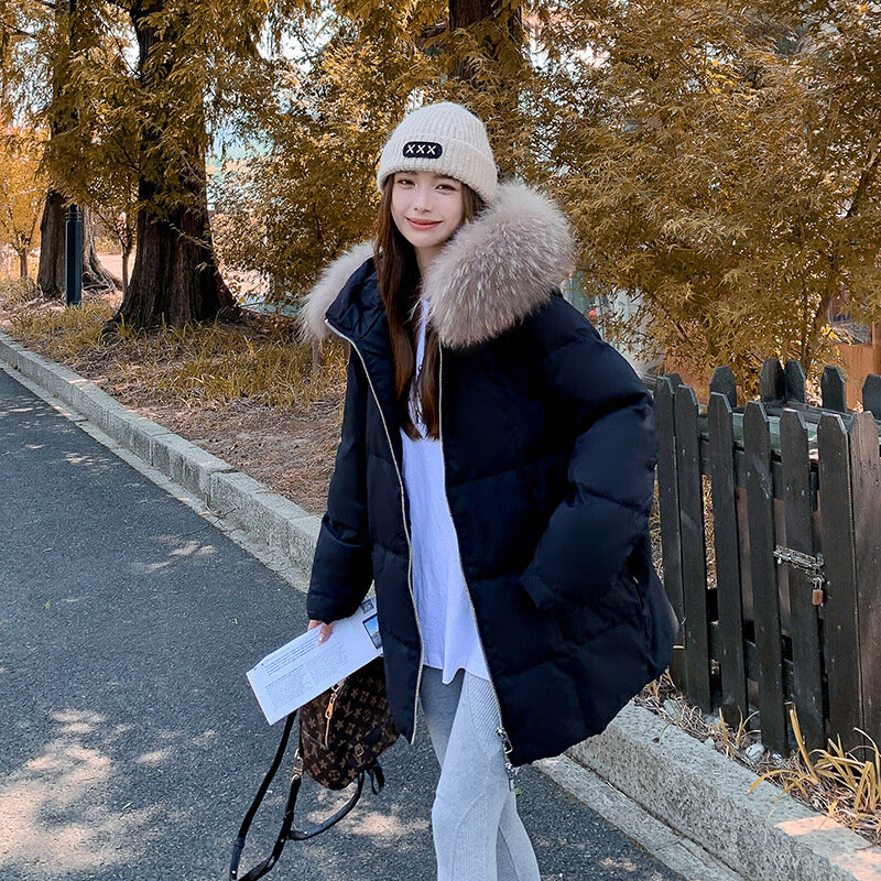 Piumino da donna collo di pelliccia di procione inverno versione coreana modelli larghi di media lunghezza cappotto giacche soprabito Outwear con cappuccio caldo