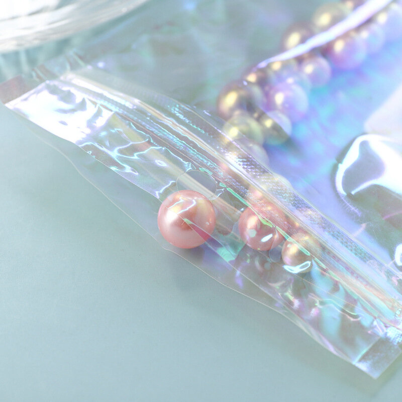 100 szt. Koperty z bąbelkami półprzezroczysta torebki z zamkiem strunowym laserowa holograficzna torba do przechowywania skarpety świąteczny prezent rękawice kosmetyki biżuteria