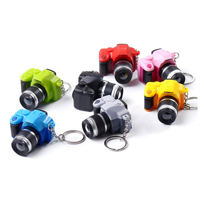 LED suono luminoso incandescente ciondolo portachiavi accessori per borse fotocamera giocattolo in plastica portachiavi per auto bambini Digital SLR Camera Toy