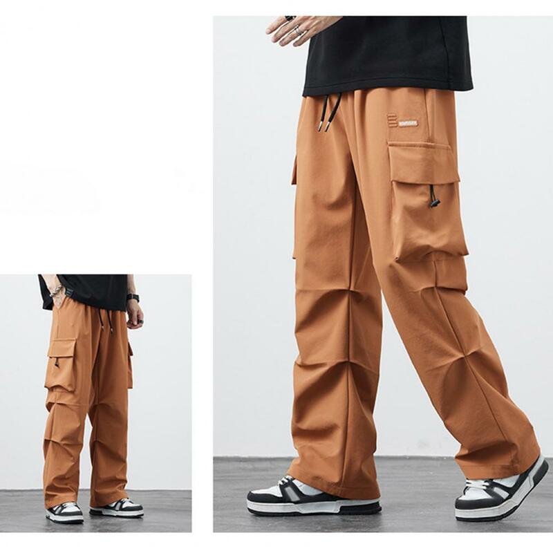 Calça de perna larga masculina com bolsos múltiplos, cintura de cordão, estilo hip-hop para trabalho, treinamento de academia estilo rua
