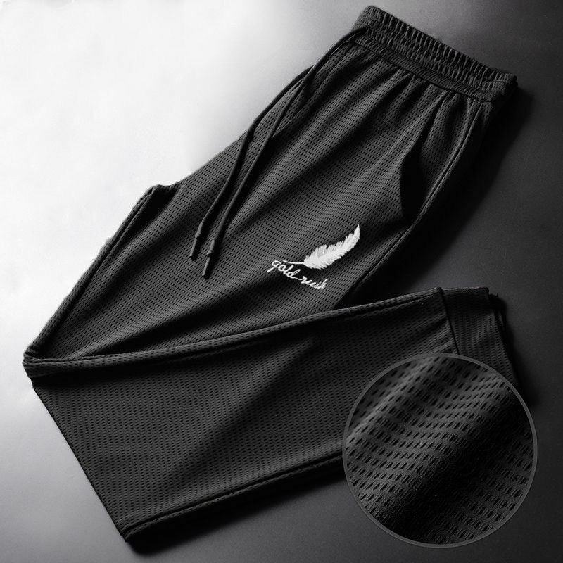 Męskie letnie spodnie lodowy jedwab siatkowe oddychające w stylu Casual, cienka spodnie szybkoschnące luźne elastyczne spodnie Fitness sportowy spodnie ze ściąganą nogawką