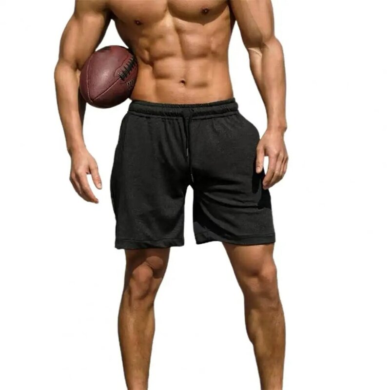 Pantalones cortos deportivos con bolsillos laterales para hombre, pantalón de chándal de entrenamiento, de cintura elástica ancha, con cordón, Color sólido