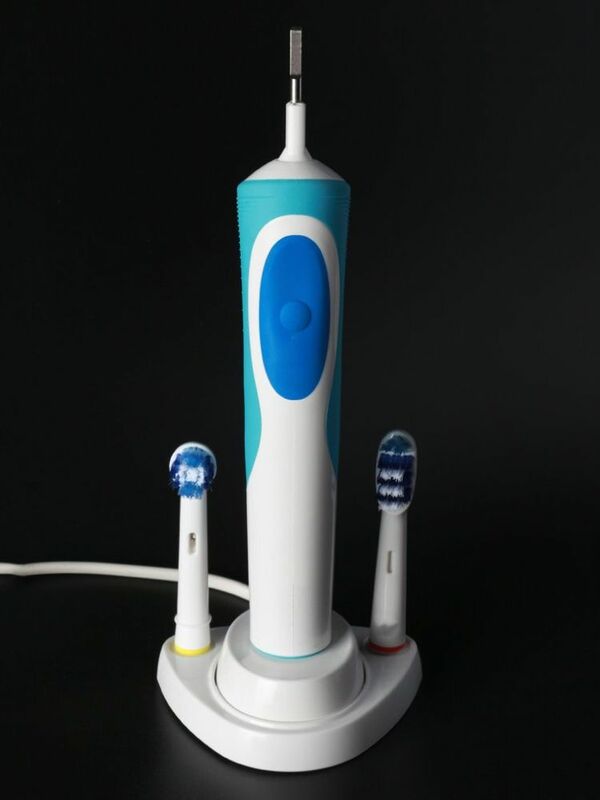 ไฟฟ้าแปรงสีฟันผู้ถือแปรงสีฟัน Stander ฐานรองรับผู้ถือฟันหัวแปรงฐาน Charger Hole