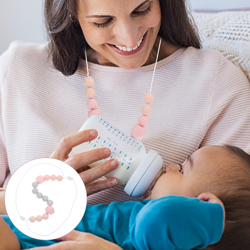 色のネックレス、赤ちゃんの歯が生える、子供の看護おもちゃ、母乳育児のためのシリコン歯がためリング