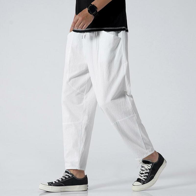 Calça casual com cordão elástico na cintura masculina, ajuste solto, bolsos grandes, calças longas finas, cor sólida simples
